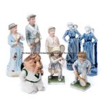 Five bisque tennis figurines, late 19th century and later, comprising boy and girl tennis players,