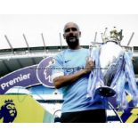 Four signed Manchester City FC photographs, comprising David Silva, Joe Hart, Vincent Kompany and