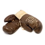 Freddie Mills fight worn boxing gloves from the 1948 British heavyweight title final eliminator