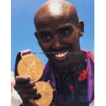 Mo Farah signed photograph, signed in black marker, in poor contrast to the photographic background,