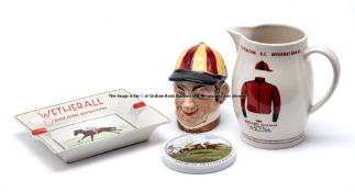 Group of four racing-themed pottery collectables, Toby-style condiment jar in the form of jockey’s