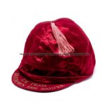 Lester Piggott's UK Team jockey cap silk for the 1982 Sandown Salver jockeys' competition, maroon,