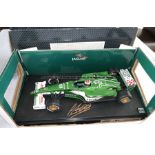 Johnny Herbert Forumla 1 memorabilia, comprising a Jaguar R1 (2000) 1:18 scale model car,