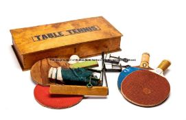 Table Tennis wooden box, labelled Table Tennis containing rustic equipment and balls dated 1930,