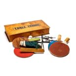 Table Tennis wooden box, labelled Table Tennis containing rustic equipment and balls dated 1930,