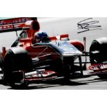 Twelve signed photographs of international former Formula 1 drivers in action, comprising David