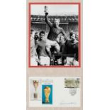 Signed Bobby Moore 1966 World Cup presentation, comprising a 9 by 7in. b&w photograph of Bobby Moore