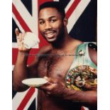 30 framed Lennox Lewis boxing photographs, comprising fight and promotional photographs, varying