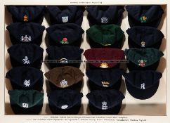 Display case containing a full set of 18 County Cricket caps and an England Test Match cap,