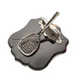 Very unusual silver tennis racquet paper clip on a tortoiseshell base,  the racquet on a hinged back