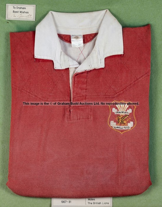 A framed Phil Bennett Llanelli RFC jersey,  the red jersey with white collar and stitched club