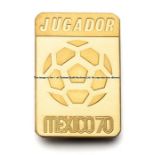 Official 1970 Mexico World Cup player’s badge, inscribed JUGADOR, gilt rectangular badge also
