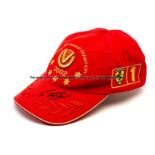 Michael Schumacher signed 2002 DVAG cap, red cap with gold embroidered logo lettered 5 TIMES F1