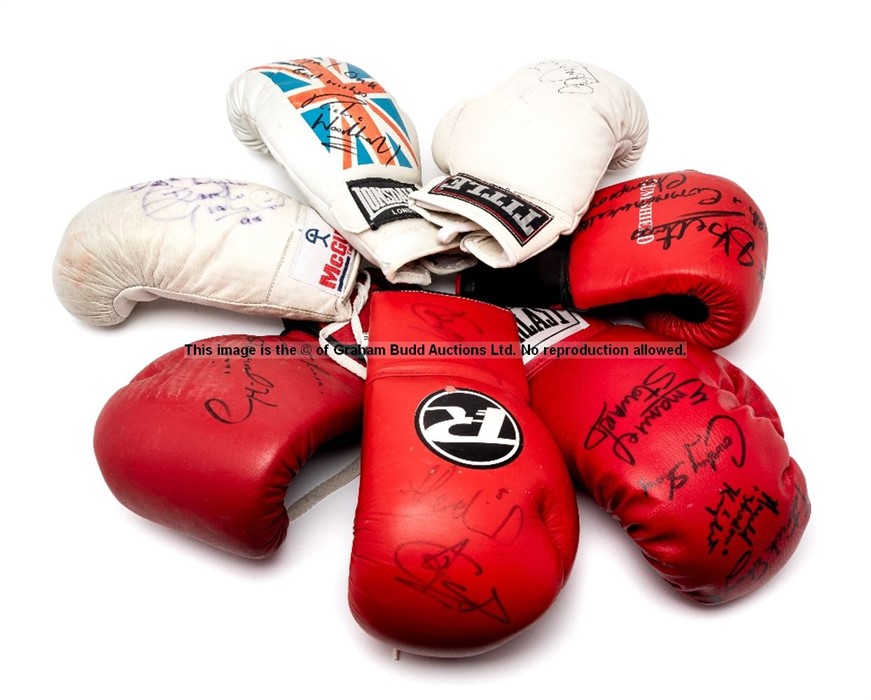 Seven signed boxing gloves, comprising a red Everlast right-hand glove signed in black marker pen by