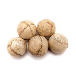 Five Jeu de Paume leather balls, of spherical form with stitched seams, diameter 3cm., wear to