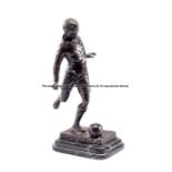 Stanley Matthews spelter figure, modelled as Stanley Matthews kicking a ball, raised upon a plinth