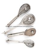 Four Victorian silver tilt head tennis racquet brooches,  each with a tennis ball on the