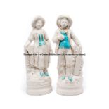 A pair of bisque porcelain cricket and tennis sporting figures, early 20th century, modelled as a
