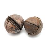 Two vintage leather-bound sporting balls, of spherical form with stitched seams, horsehair interior,