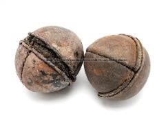 Two vintage leather-bound sporting balls, of spherical form with stitched seams, horsehair interior,