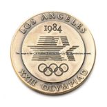 Los Angeles 1984 Olympic Games participation medal, designed by Dugald Stermer, flaming Olympic