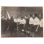 1930s b&w photograph of the England soccer team being introduced to dignitaries before a fixture,