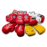 Five signed pairs of boxing gloves, comprising red and white BBE gloves signed in black marker pen