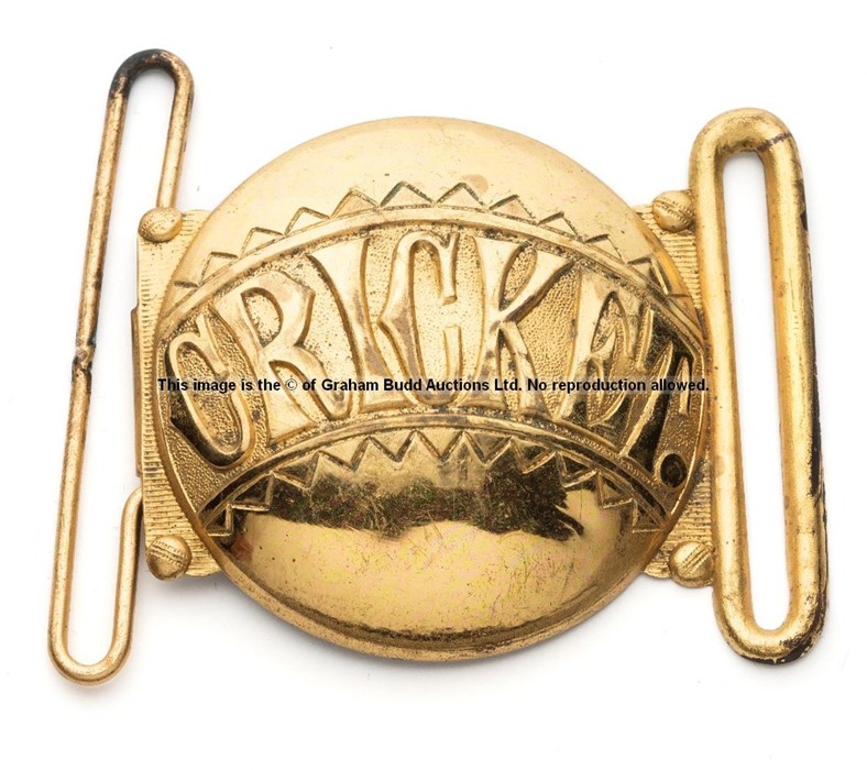Cricket themed brass belt buckle, circular buckle inscribed CRICKET, with two belt loops, 6 by 7.