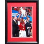 Thierry Henry signed colour photograph, featuring the Arsenal player lifting the 2001-02 Barclaycard