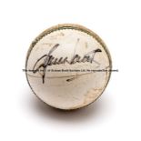 Shane Warne signed white one-day cricket ball, signed in black marker pen