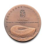 Beijing 2008 Olympic Games participant's medal, copper, 55mm., Games logo over Bird's Nest Olympic