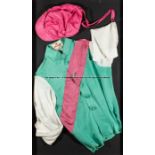 Framed racing silks of Prince Khalid Abdullah, the familiar green, white and pink colours made