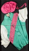 Framed racing silks of Prince Khalid Abdullah, the familiar green, white and pink colours made