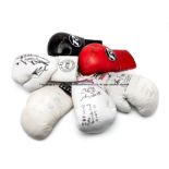 Six signed boxing gloves, comprising a Jason Booth and Steve Molitor signed Lonsdale boxing glove,