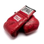 Lennox Lewis, Andrew Golota and Lou Duva signed boxing gloves, the red Everlast gloves signed in