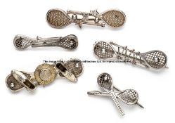 Five Victorian silver tennis brooches, comprising three double racquet brooches; one with shoes