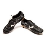 Michael Dawson signed match worn Puma football boots, black with white PUMA symbol, each stitched