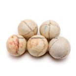 Five Jeu de Paume leather balls, of spherical form with stitched seams, diameter 5cm., wear to