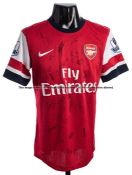 Jack Wilshere team-signed Arsenal FC red and white No.10 home jersey circa 2013, 20 signatures in