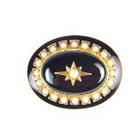 Victorian onyx and pearl mourning brooch.