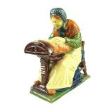 A Flemish pottery lacemaker figure by Pieter Jozef Laignel of Courtrai, Belgium.