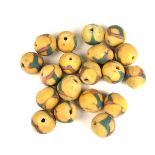 Tribal Art: A group of African yellow, red and green powder glass trade beads, Ghana, West Africa.