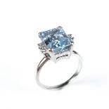 18 ct white gold blue topaz and diamond ring.
