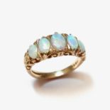 9 ct yellow gold five stone opal ring.
