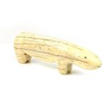 A large Inuit carved walrus tusk polar bear, probably 19th century.