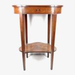 An Edwardian kidney shaped side table.