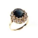 9 ct yellow gold sapphire and diamond cluster ring.