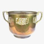 An Art Nouveau brass twin handled jardinière bowl, early 20th century.