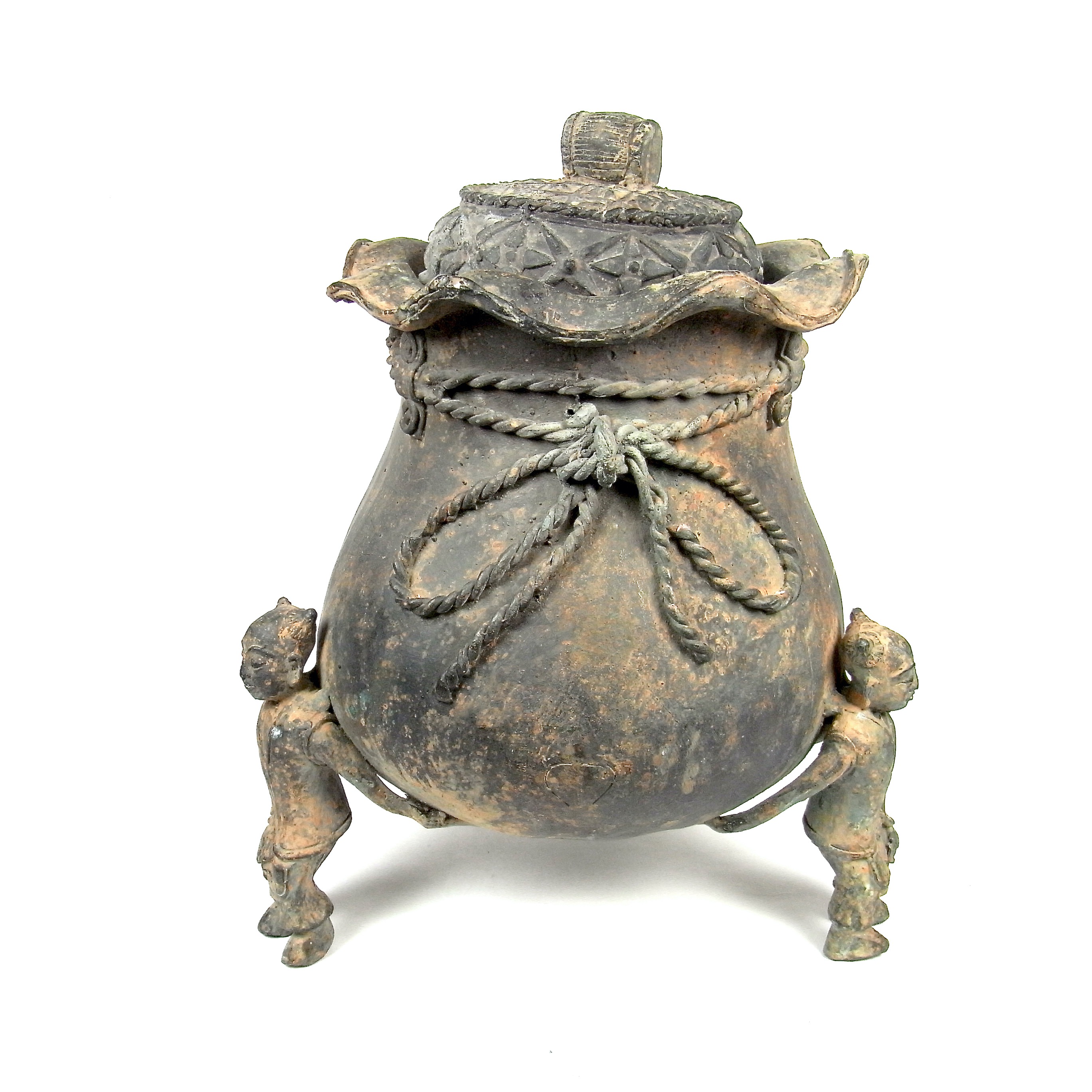 A large Chinese bronze tripod vessel and cover.