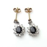 White gold sapphire and diamond flower cluster earrings.